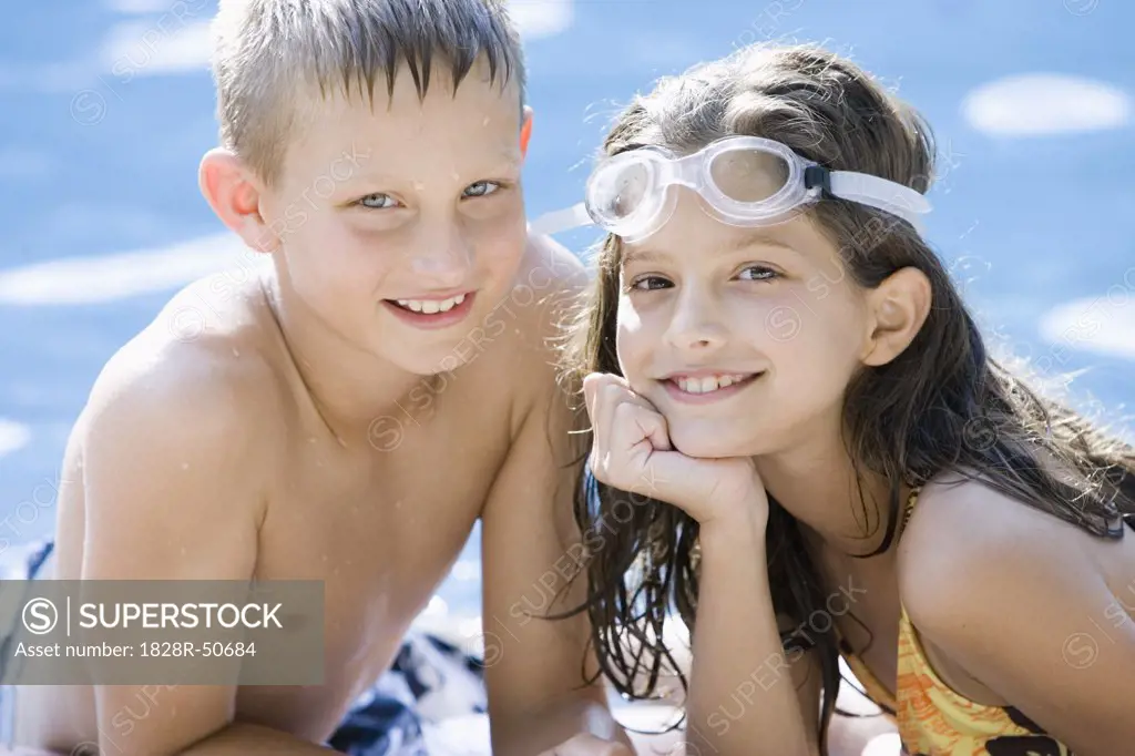 Boy and Girl by Swimming Pool   