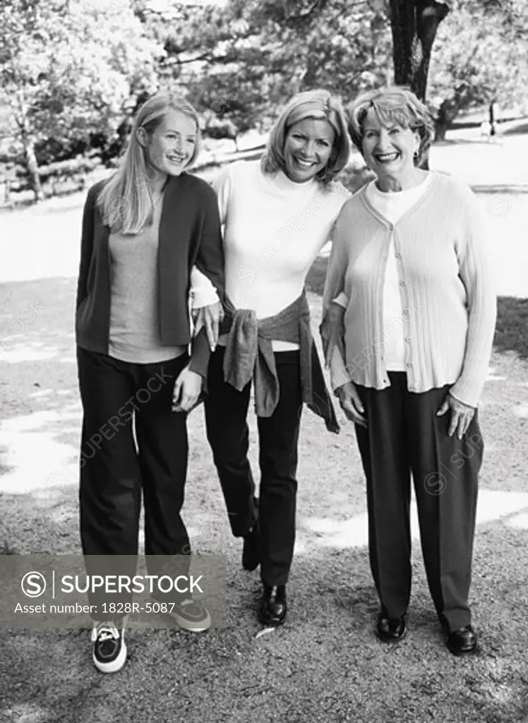 Grandmother, Mother and Daughter Walking Outdoors   