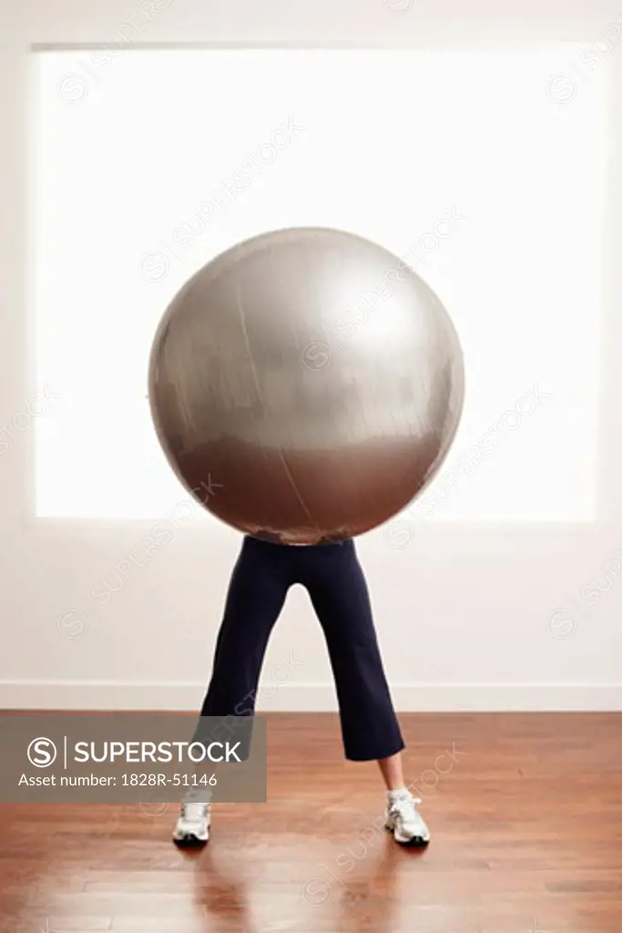 Woman Holding Exercise Ball   