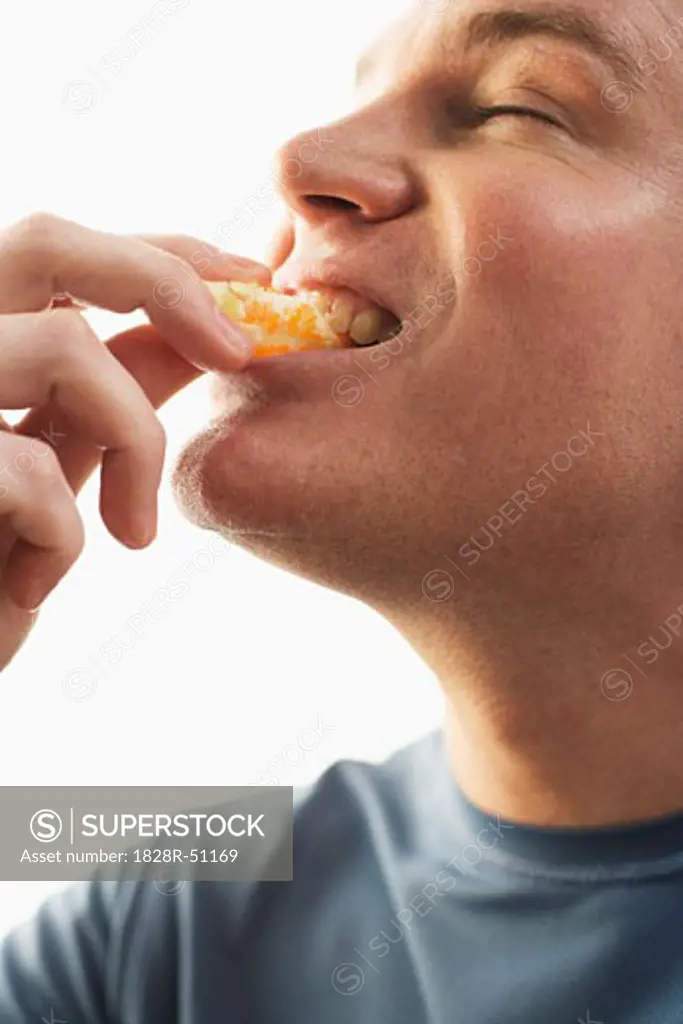 Man Eating Orange   