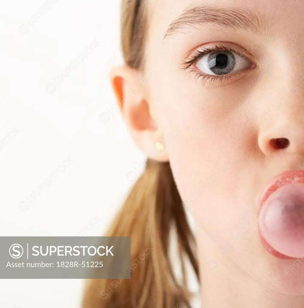 Girl Blowing Bubble with Gum   