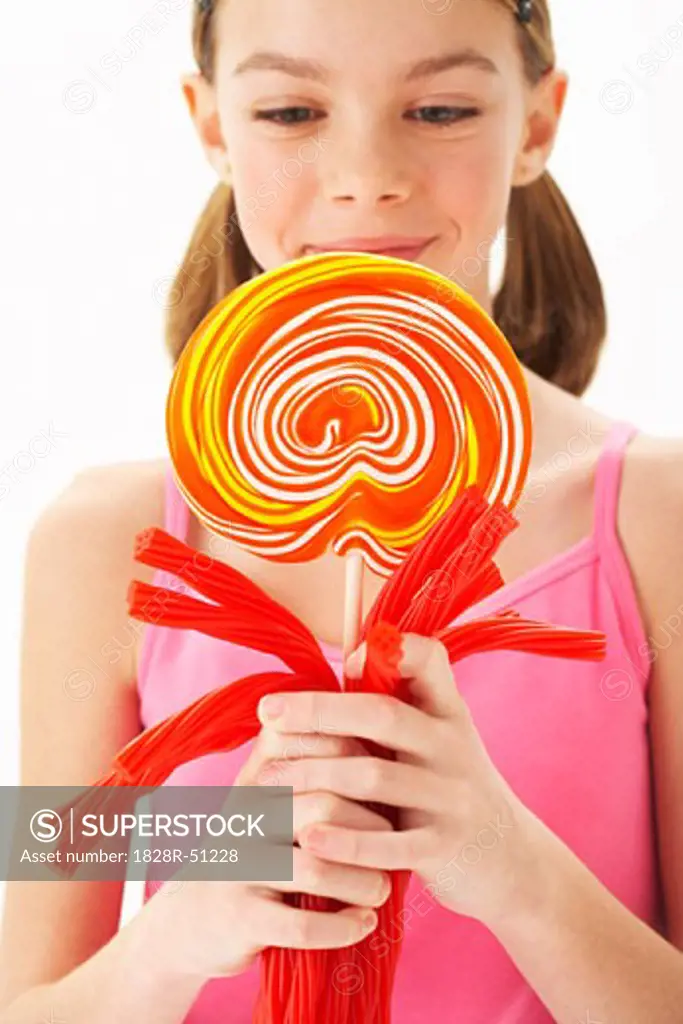 Girl Holding Licorice and large Lollipop   