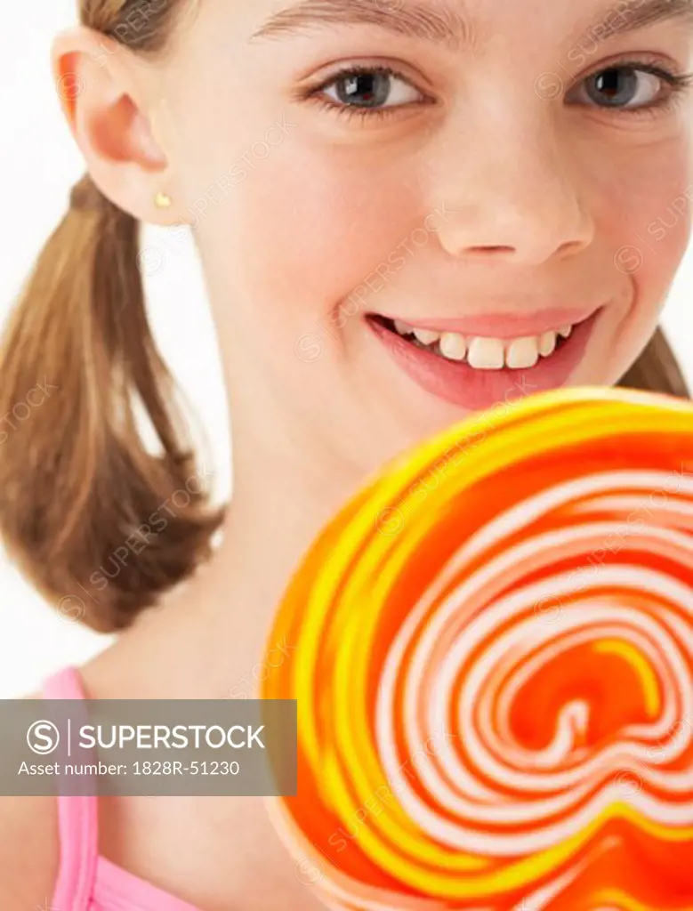 Girl Holding large Lollipop   