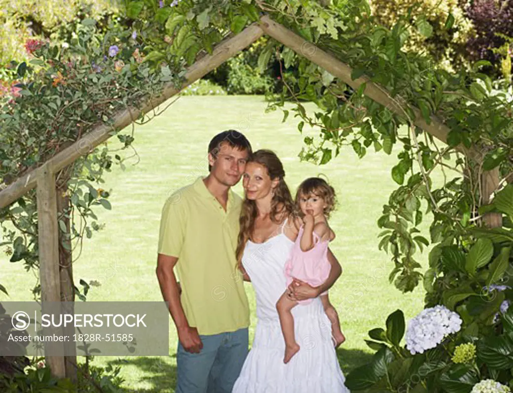 Portrait of Family Under Arbor   