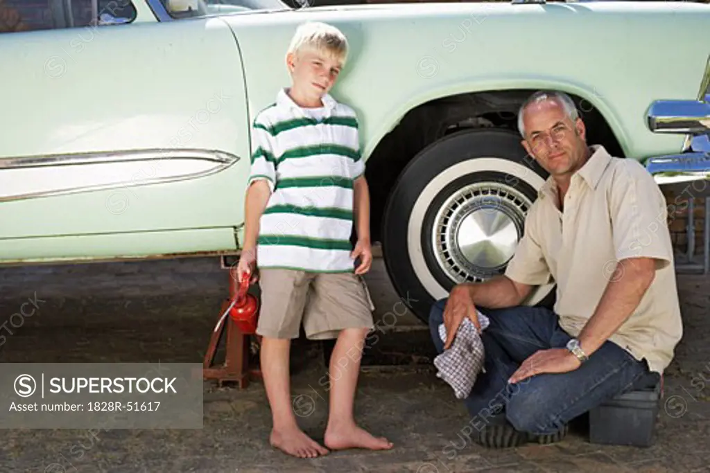 Portrait of Family Fixing Car   
