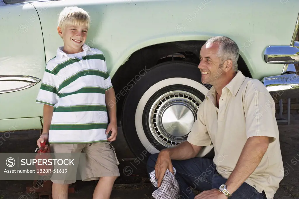 Portrait of Family Fixing Car   