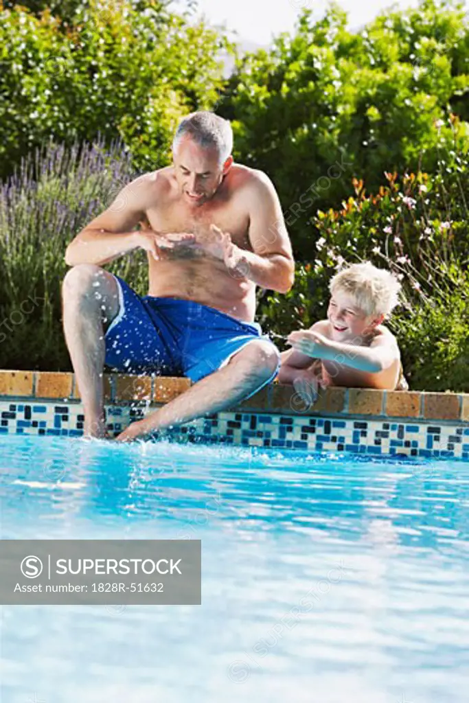 Father and Son by Swimming Pool   