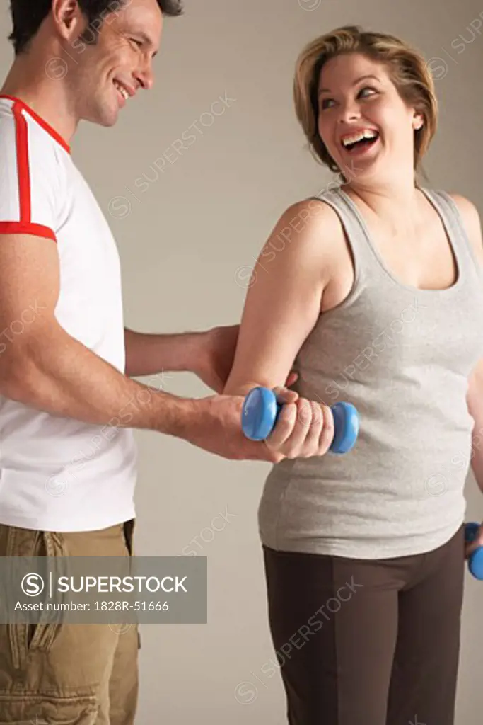 Woman With Personal Trainer   