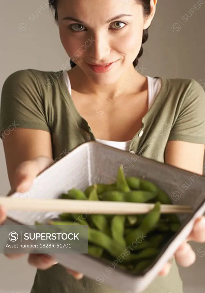 Woman Holding Bowl of Peas   