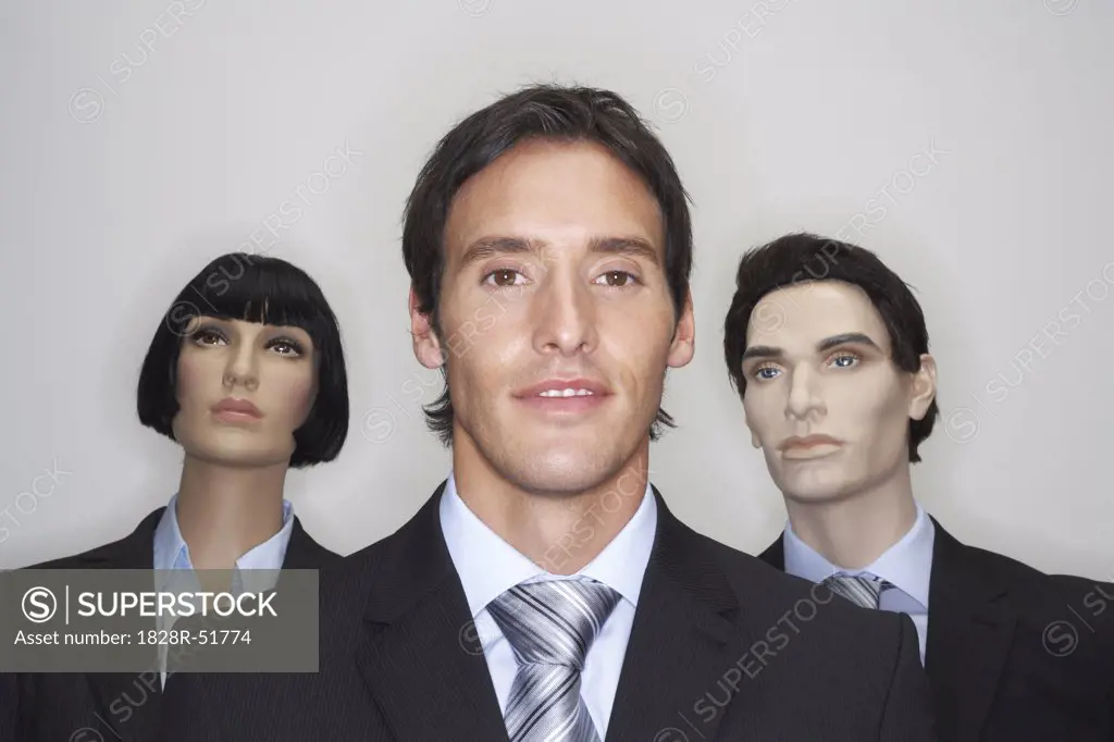 Businessman with Mannequins