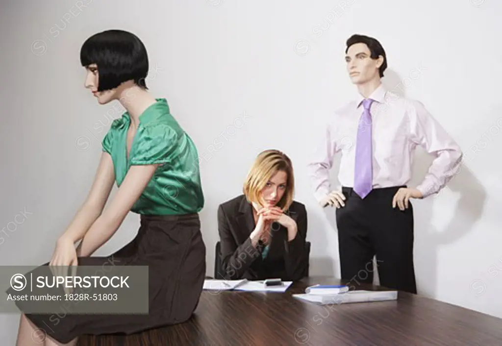 Buisnesswoman and Mannequins in Office