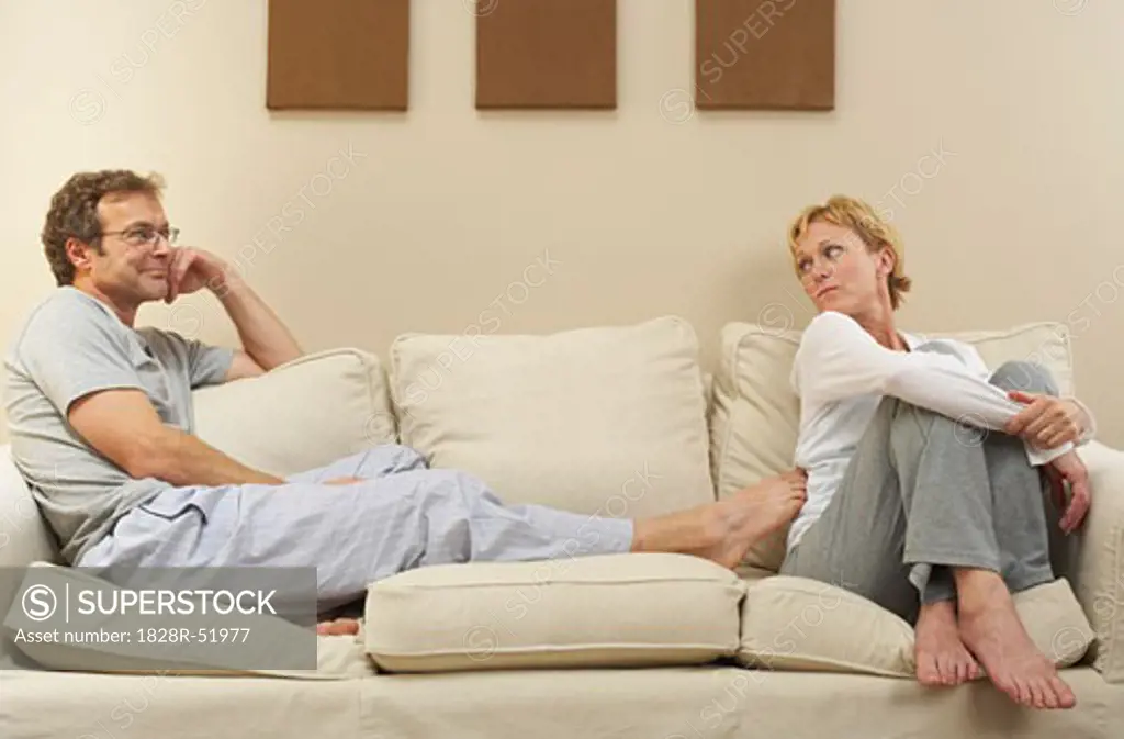 Couple Sitting on Sofa   