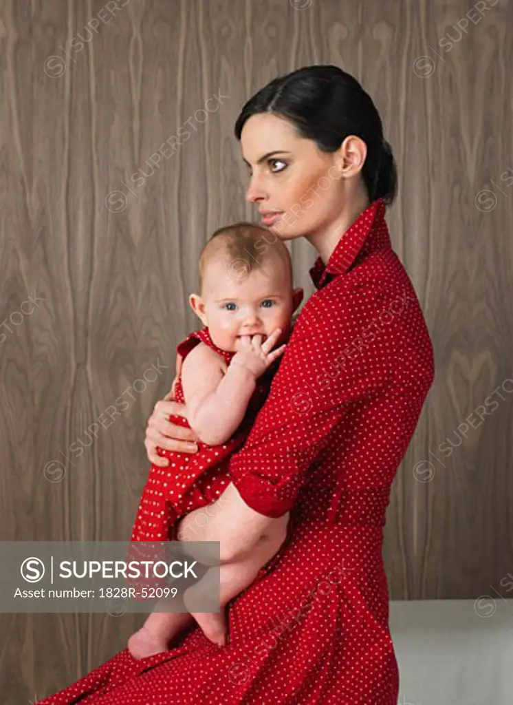 Mother Holding Baby Girl   