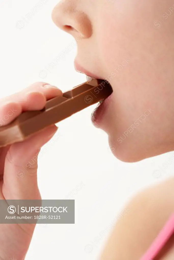 Girl Biting Chocolate Bar   