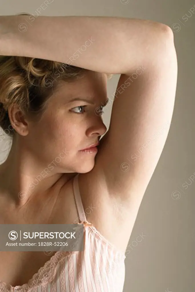 Woman Smelling Armpit   