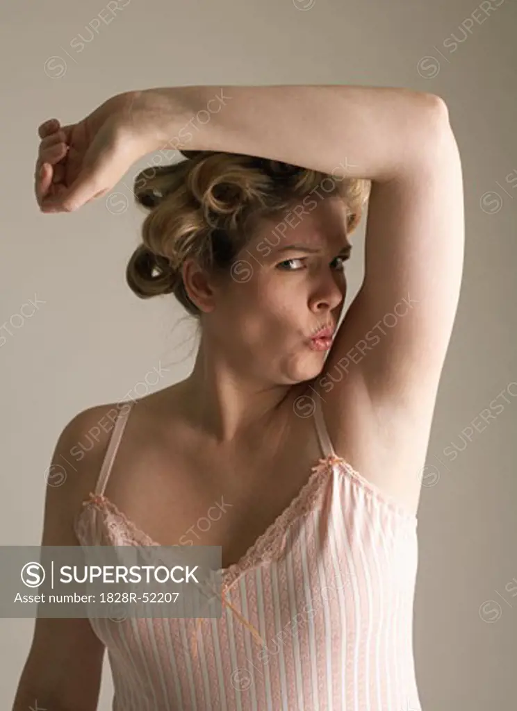 Woman Smelling Armpit   