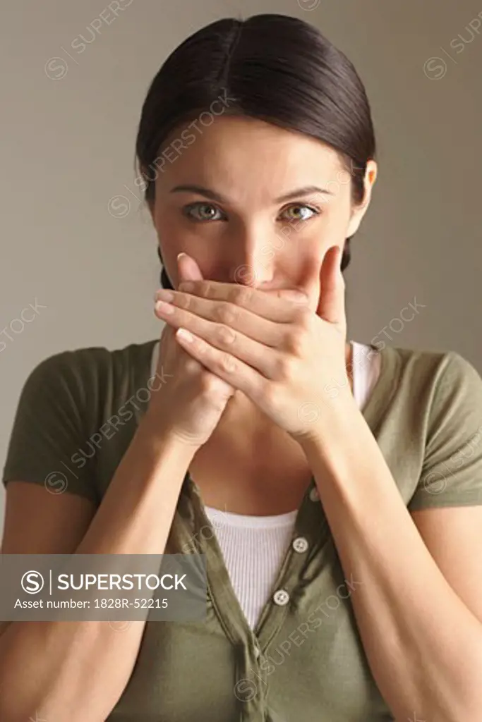 Woman Covering Mouth with Hands   