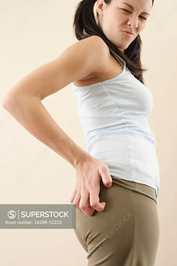 Woman Scratching Buttocks   