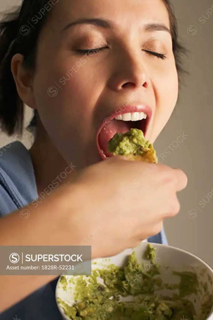 Woman Eating Guacamole   