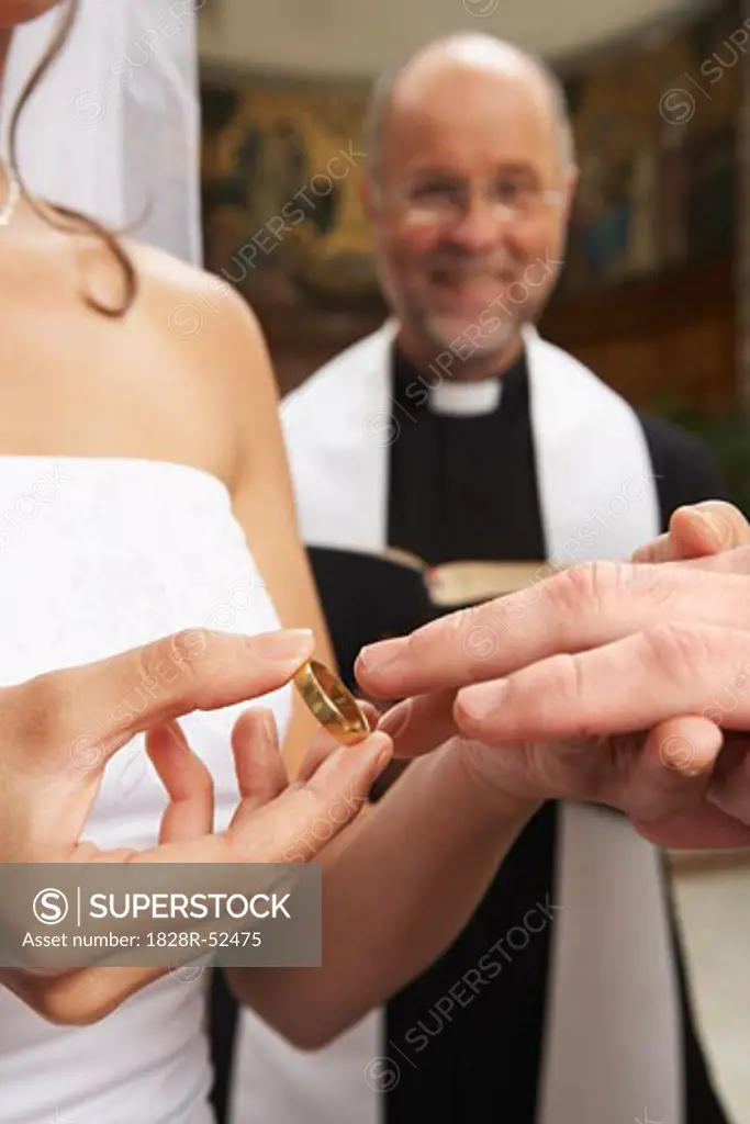 Bride Holding Wedding Ring   