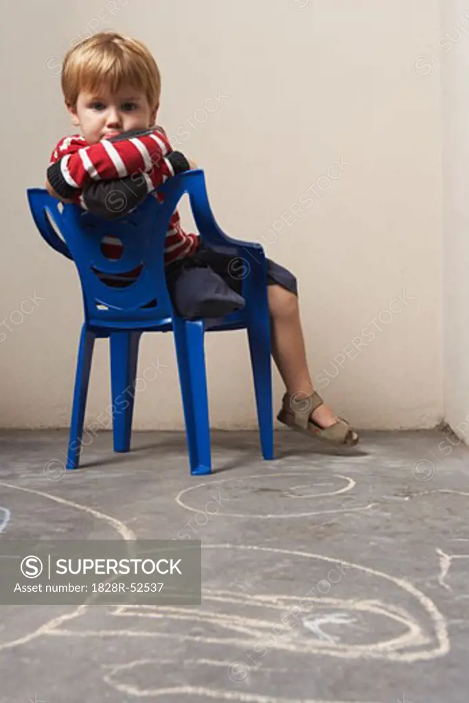 Boy Sitting in Chair   