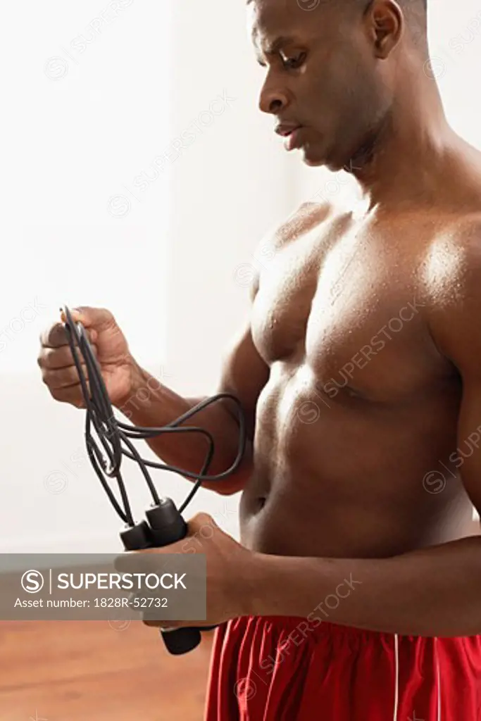 Man Holding Jumping Rope   