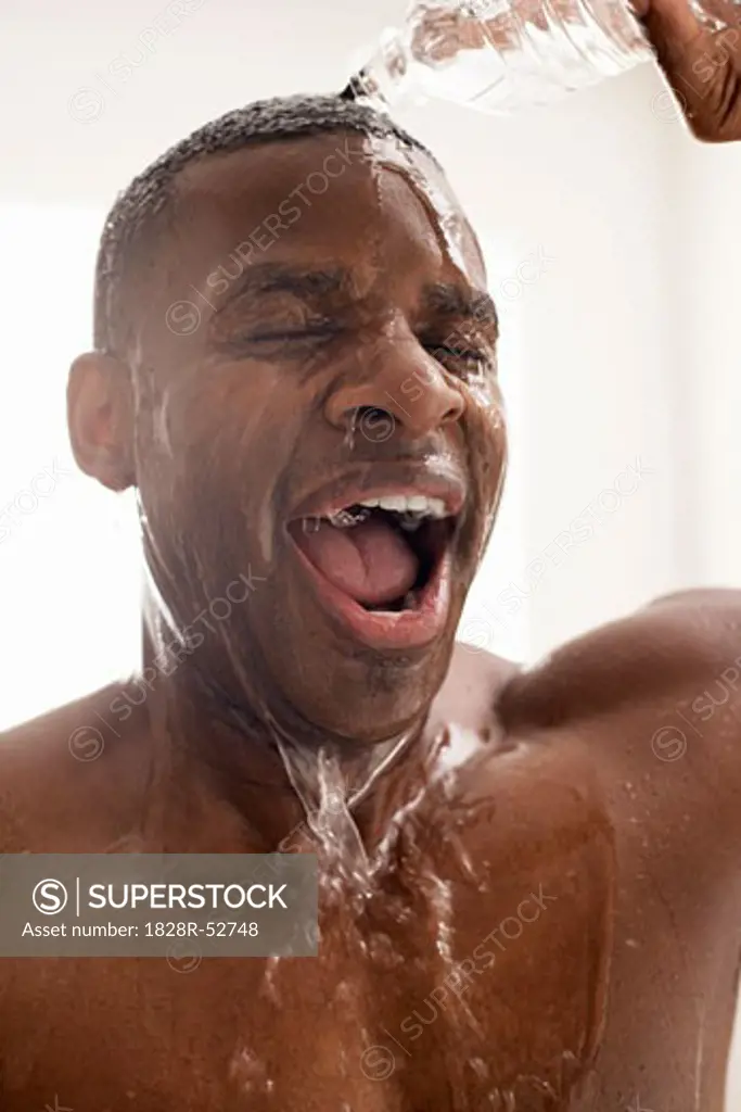 Man Splashing Water on Face   