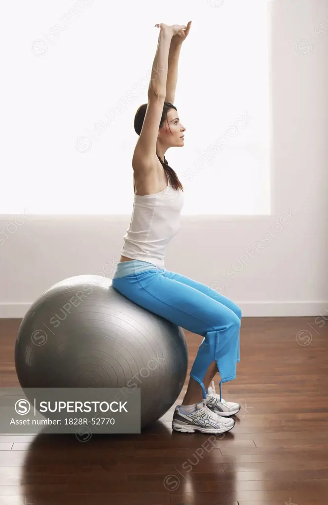 Woman Sitting on Exercise Ball   