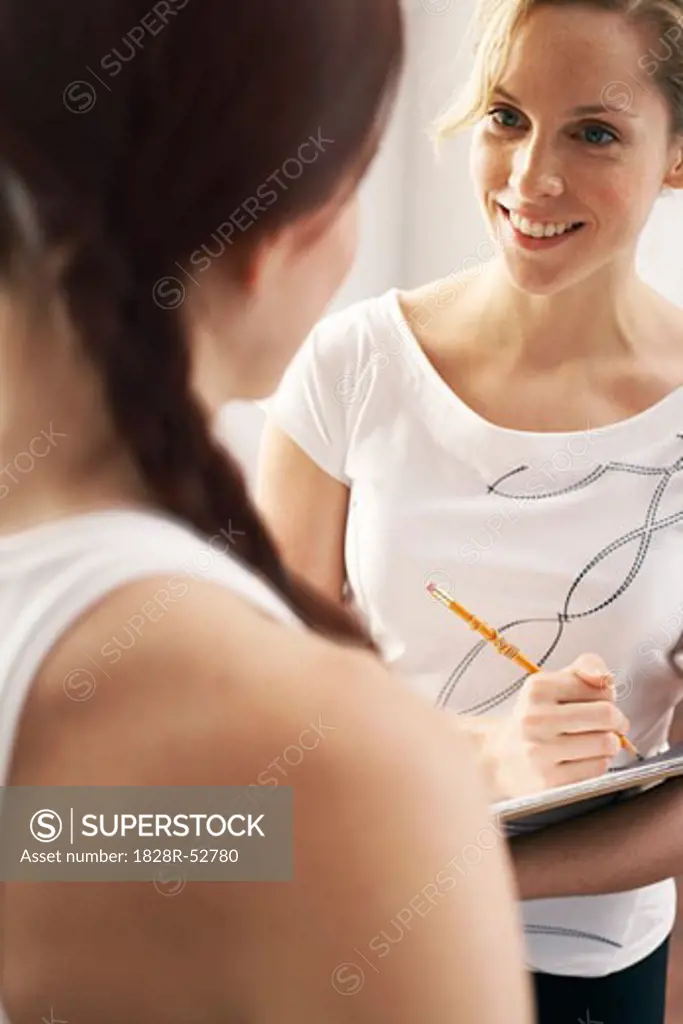 Woman Meeting With Personal Trainer   