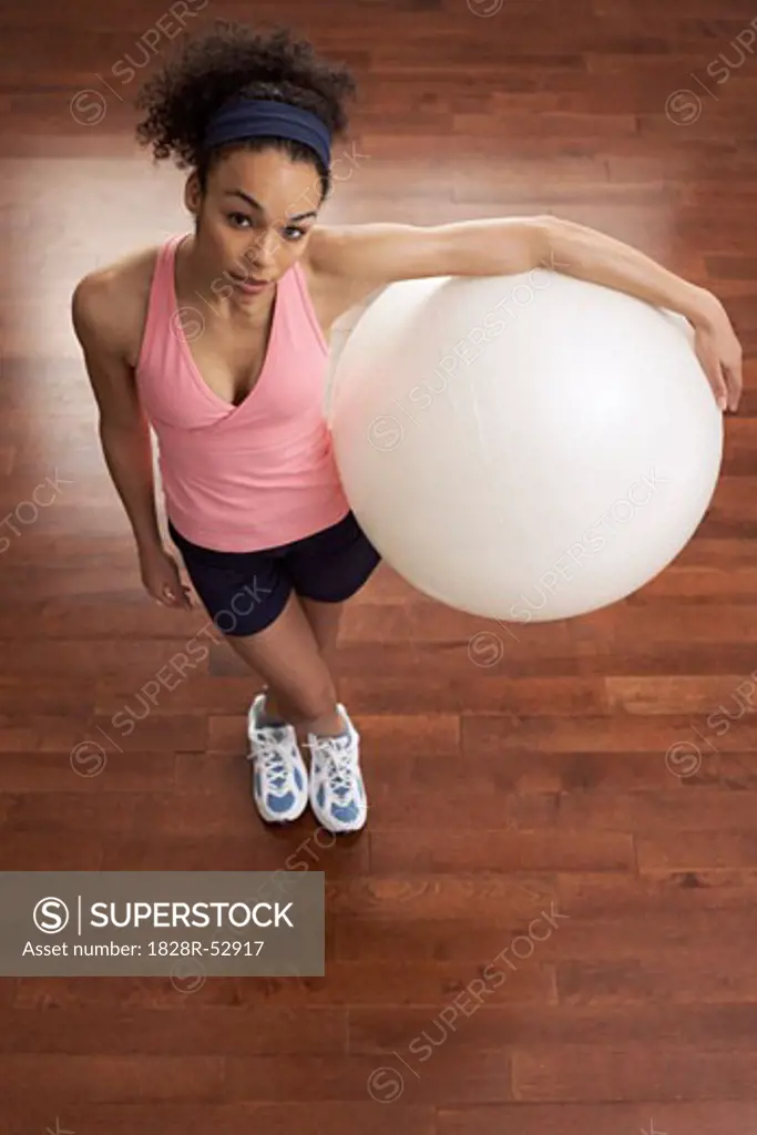 Woman Holding Exercise Ball   