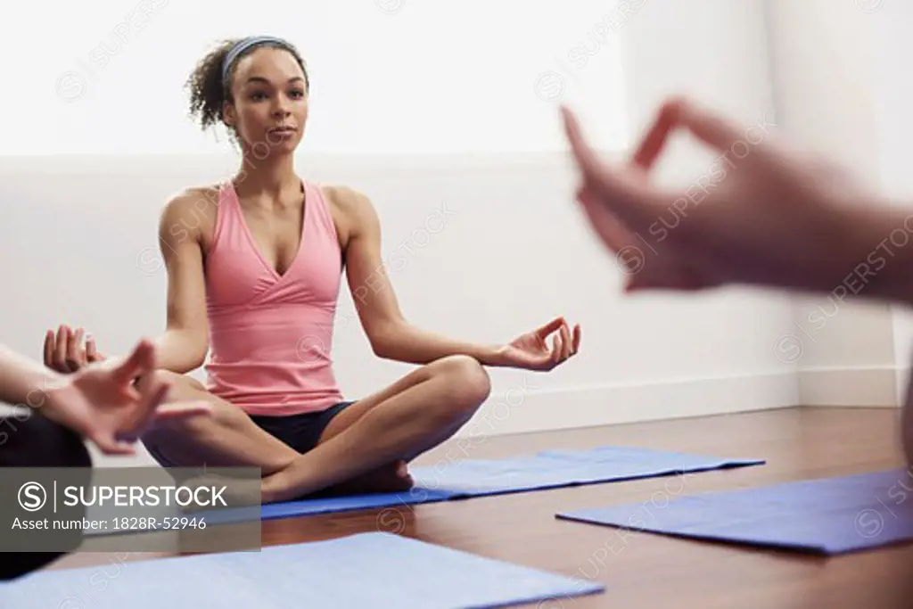 Women Practicing Yoga   