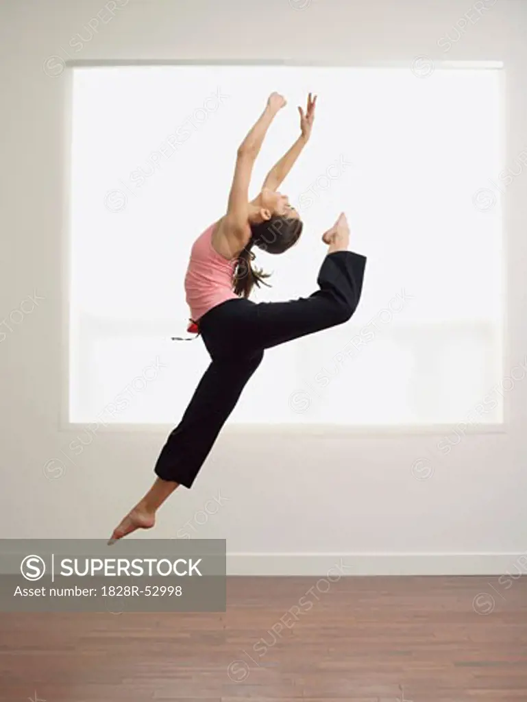 Ballet Dancer Jumping in Air   