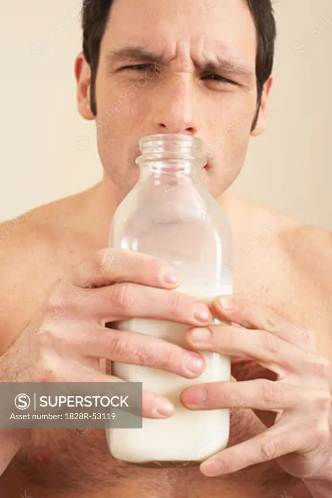 Man Smelling Milk   