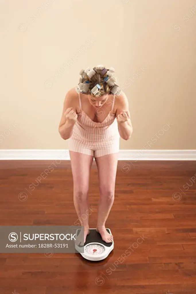 Woman Weighing Self   