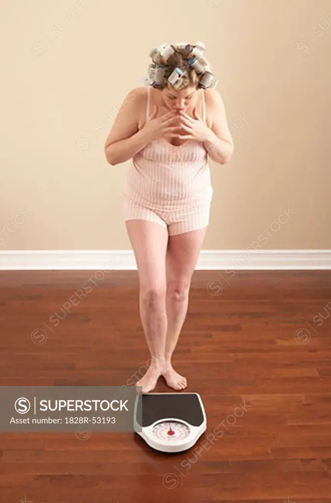 Woman Stepping onto Scale   