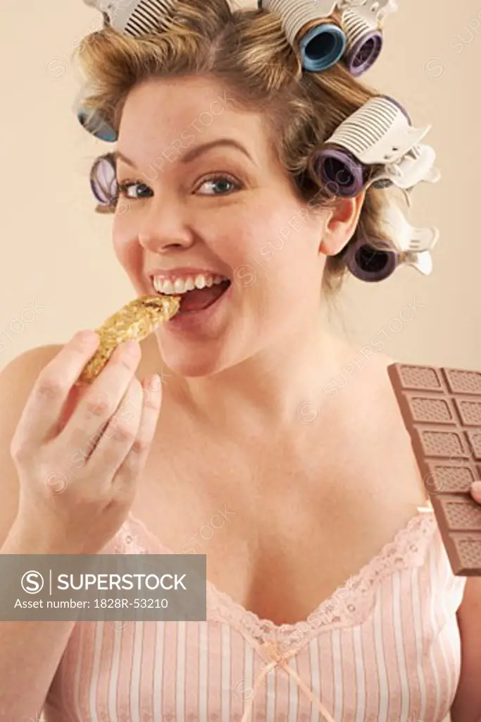Woman with Granola Bar and Chocolate Bar   