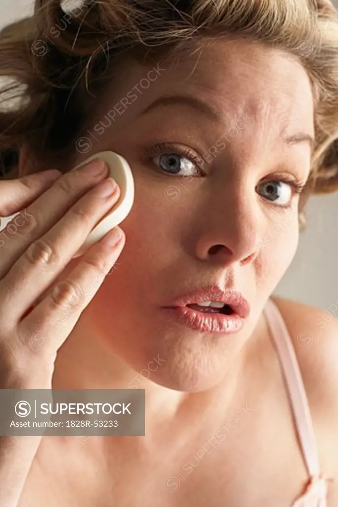 Woman Cleaning Face   