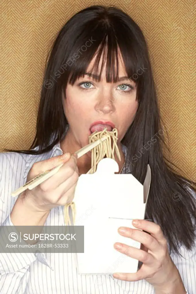 Woman Eating Take-Out Food   