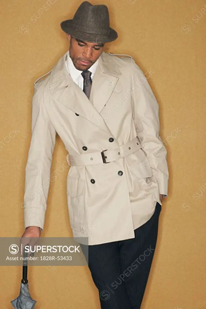 Man in Trench Coat and Hat   