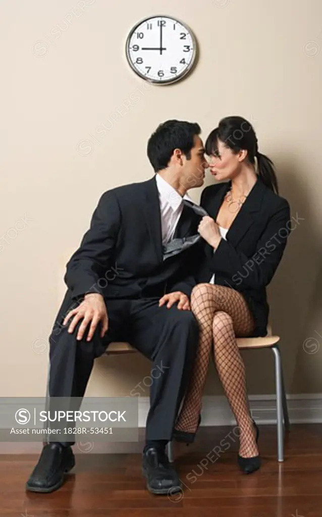 Woman and Man Flirting in Waiting Area   