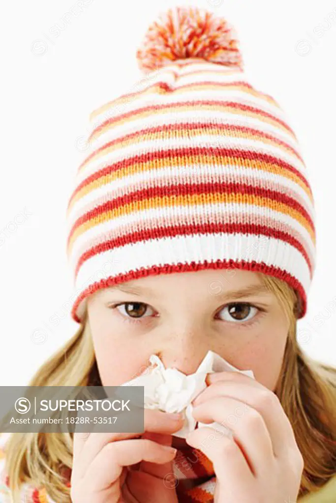 Girl in Toque Blowing Nose   