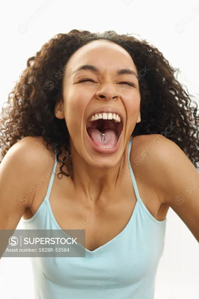 Portrait of Woman with Pierced Tongue Laughing   