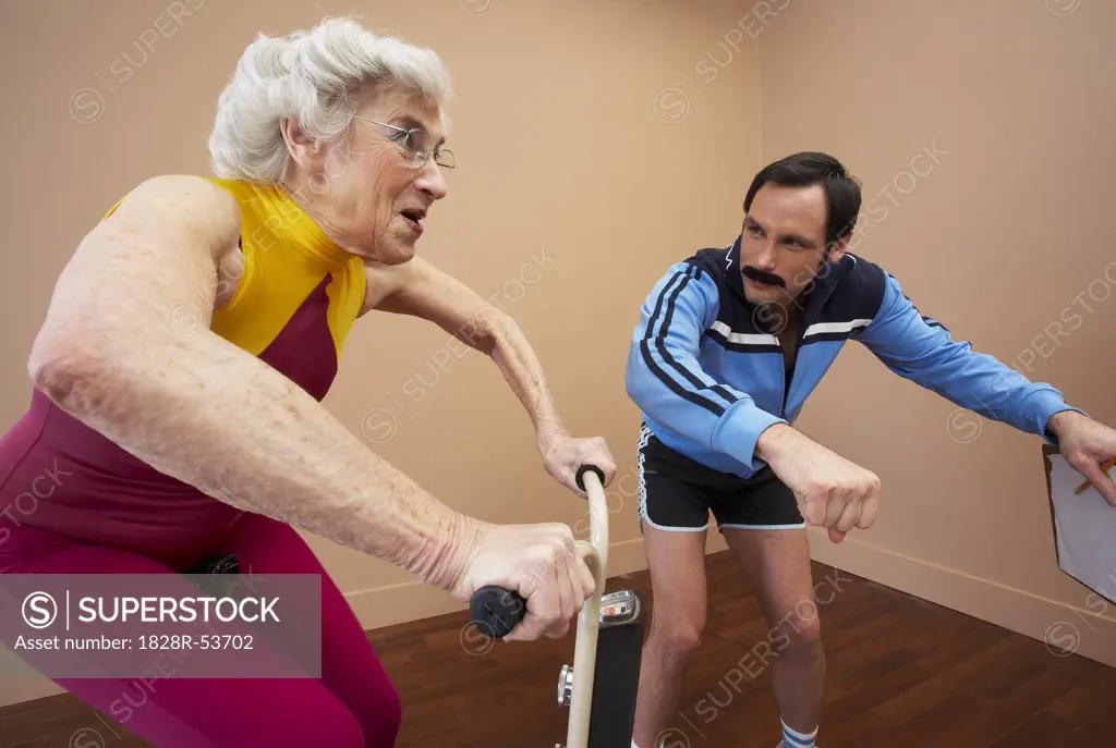 Woman Exercising with Trainer   