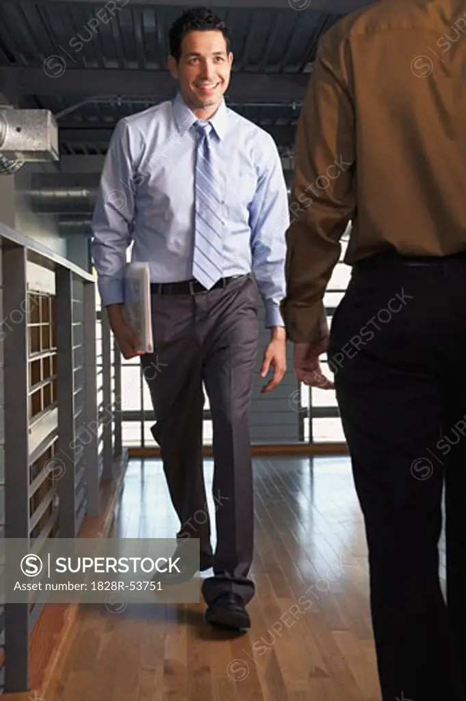 Businessmen Passing Each Other   