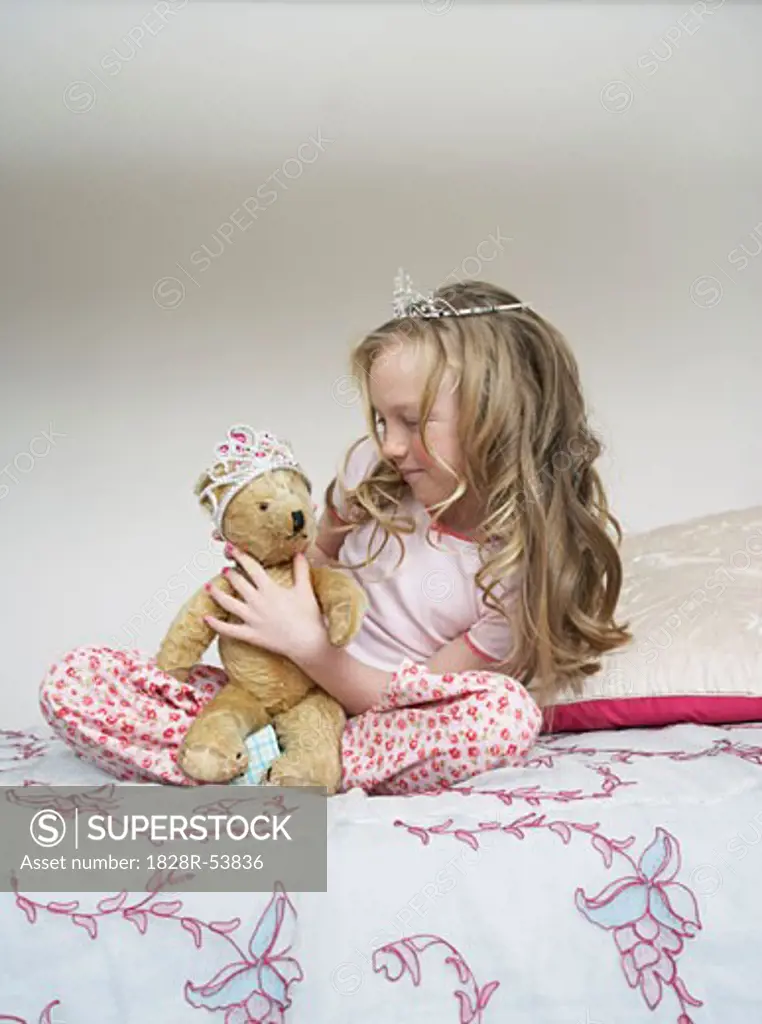 Girl Playing With Teddy Bear   