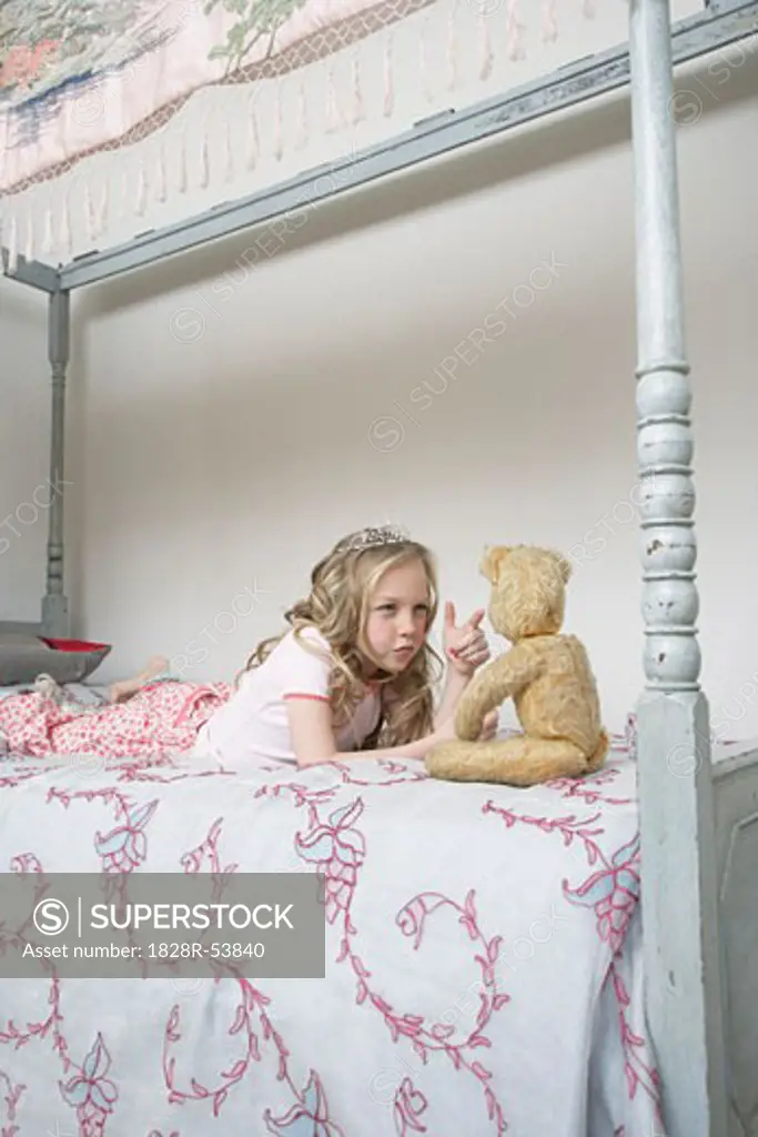 Girl Playing With Teddy Bear   