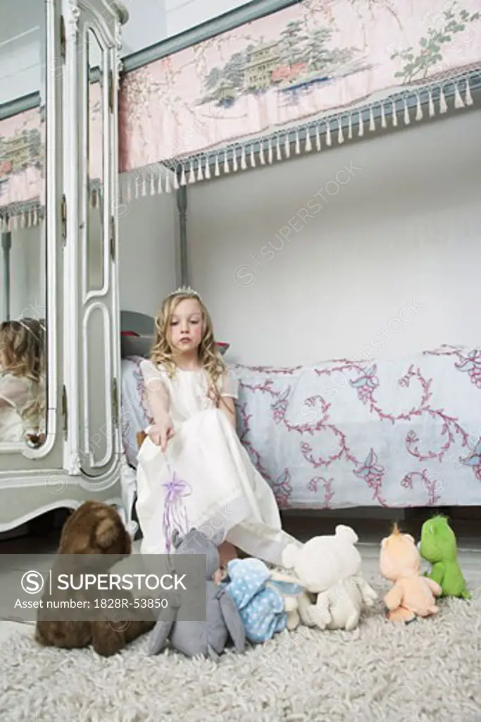 Girl Playing with Toys in Bedroom   
