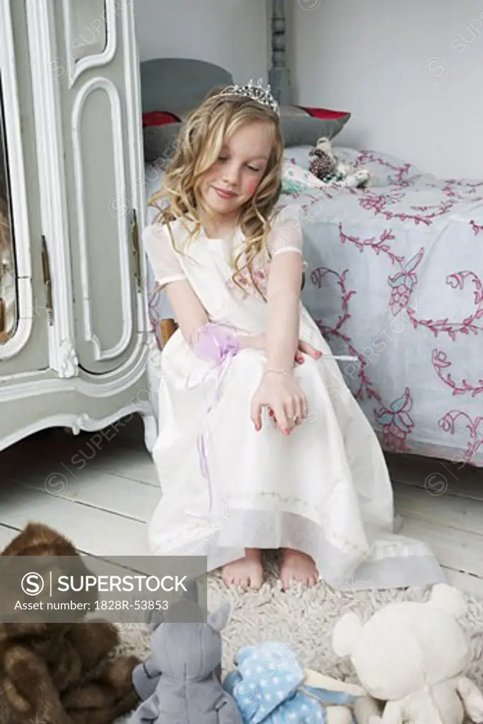 Girl Playing with Toys in Bedroom   
