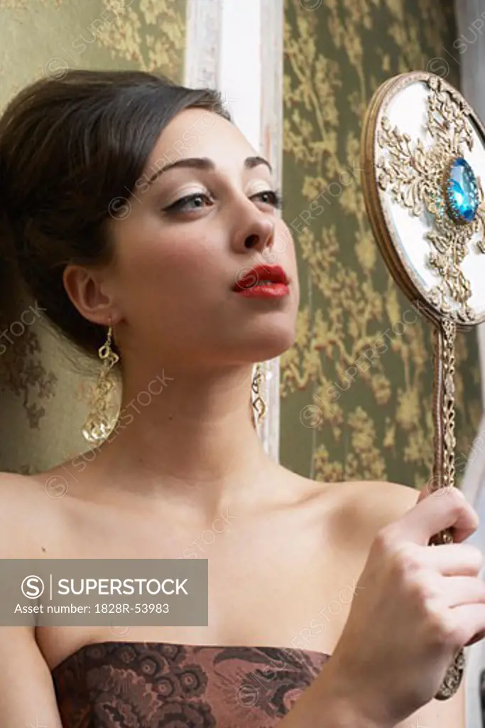 Woman Staring at Mirror   