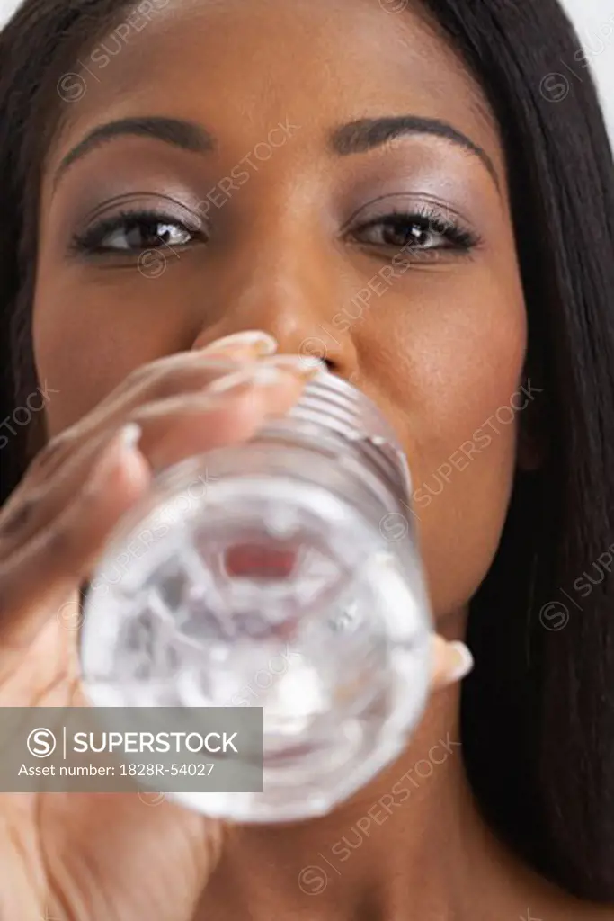 Woman Drinking Bottled Water   